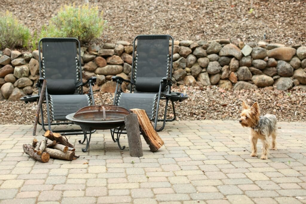 Clean stone patio with fire pit