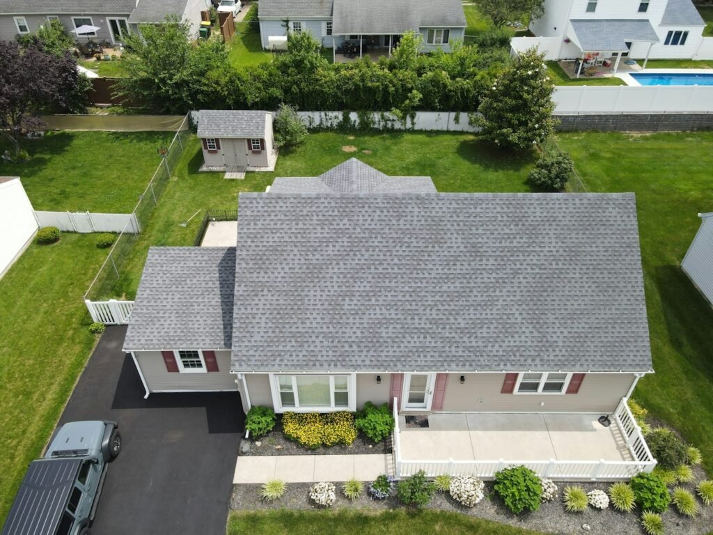 Clean asphalt shingle roof on a suburban home